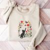 Picture of Embroidered Black Cat Chasing Butterfly Meadow Sweatshirt , Flower With Cat Hoodie, Black Cat And Wildflowers Sweatshirt, Cat Lover Shirt