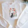 Picture of Embroidered Black Cat Chasing Butterfly Meadow Sweatshirt , Flower With Cat Hoodie, Black Cat And Wildflowers Sweatshirt, Cat Lover Shirt