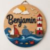 Picture of Personalized Ocean Nautical Name Sign, Custom Kids Room Door Hanger, Whale Lighthouse Nursery Wall Decor, Ocean Baby Gift, Round Wood Sign