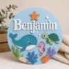 Picture of Personalized Ocean Name Sign, Custom Under The Sea Door Hanger, Whale Turtle Nursery Wall Decor, Kids Room Baby Gift, Round Wood Sign Gift