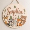 Picture of Personalized Woodland Name Sign, Custom Kids Room Door Hanger, Forest Animal Nursery Wall Decor, Baby Room Gift, Round Wood Sign Animal