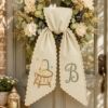 Picture of Personalized Baby Wreath Sash, Custom Embroidered Bassinet Monogram Sash, New Baby Door Decor, Nursery Wreath Bow, Baby Shower Gift