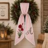 Picture of Personalized Christmas Sash, Embroidered Amaryllis Monogram Sash, Red Stripe Holiday Accessory, Custom Initial Christmas Gift Sash Wreath