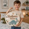 Picture of Personalized Dinosaur Name Sign, Custom Kids Room Door Hanger, Dino Nursery Wall Decor, Boys Bedroom Decor, Round Wood Sign, Baby Gift Dino