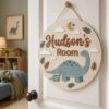 Picture of Personalized Dinosaur Name Sign, Custom Kids Room Door Hanger, Dino Nursery Wall Decor, Boys Bedroom Decor, Round Wood Sign, Baby Gift Dino