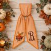 Picture of Personalized Fall Sash, Embroidered Candy Corn Monogram Sash, Orange Gingham Autumn Sash, Halloween Spooky Gift, Halloween Fall Accessory