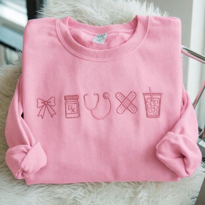 Picture of Embroidered Nurse Icon Sweatshirt, Healthcare Shirt, CNA Sweatshirt, Medical Assistant, Nursing Grad Gift, Coquette Nursing Sweatshirt