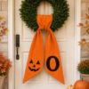 Picture of Personalized Halloween Wreath Sash, Pumpkin Face Monogram Door Bow, Orange Halloween Wreath Decor, Spooky Front Door Decoration Halloween